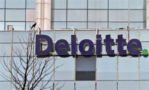 FILE PHOTO: The Deloitte logo is seen on a commercial tower at Gurgaon, on the outskirts of New Delhi