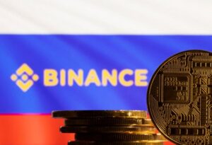 FILE PHOTO: Illustration shows a representation of the cryptocurrency, Binance logo and Russian flag